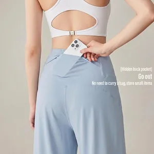 Pantalon de yoga évasé bleu clair à taille haute avec une poche arrière cachée pratique