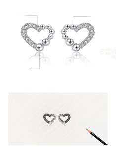 Macro shot of S925 sterling silver heart studs with hand-set 5A cubic zirconia stones
