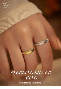 Close-up of S925 sterling silver ring featuring a textured wavy brushed metal surface