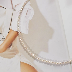 Macro shot of oval freshwater pearls necklace with natural luster on a lifestyle background