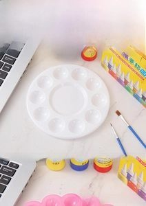 Detail of 10-well plastic palette with 12-color finger paint set and brushes for students