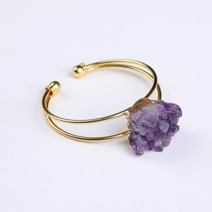 Adjustable gold plated cuff bracelet with a raw natural purple amethyst crystal cluster