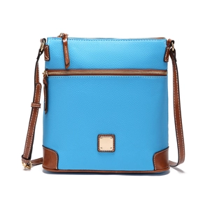 Close-up of sky blue lychee grain leather crossbody bag with brown leather trim and gold logo
