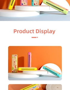 Detail of 16-hole wooden harmonicas for kids with colorful cartoon patterns and smooth edges