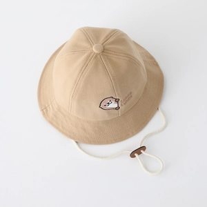 Detail of baby sun hat featuring animal embroidery and adjustable drawstring strap