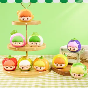 Detailed display of cute vegetable and fruit resin figurines on a tiered wooden display stand