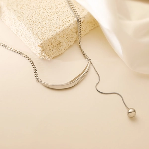 Minimalist silver stainless steel collar necklace with crescent bar and sphere charm