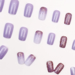 Sparkly aurora purple press-on nails in short square shape with glitter and pearl finish