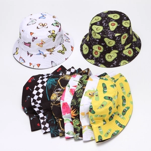 Flat lay of bucket hats featuring various cute cartoon embroidery like avocado and butterfly