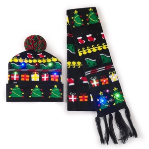 Detail of black LED knit Christmas hat and scarf set with festive holiday patterns