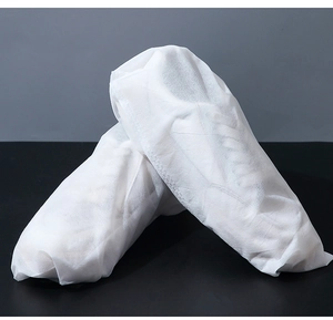 Detail of white non-woven dust bag for shoes showing textured fabric and protective wrap
