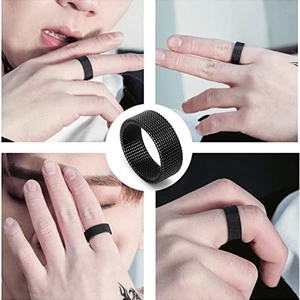 Unisex black titanium steel ring with textured mesh pattern in a minimalist industrial style