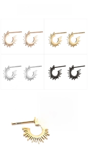 Detail view of geometric sunburst stud earrings in gold, silver, rose gold, and black finishes