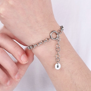 Silver stainless steel chain bracelet featuring a round pendant with the letter B