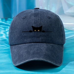 Navy blue washed cotton baseball cap with embroidered black cat motif and yellow eyes