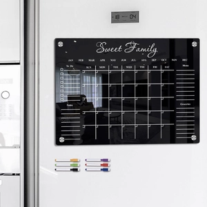 Macro view of black magnetic acrylic weekly calendar board for fridge with 6 markers