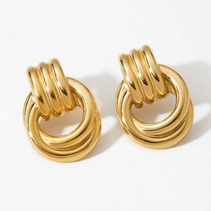 Vintage gold layered hoop earrings with textured finish and retro door knocker style