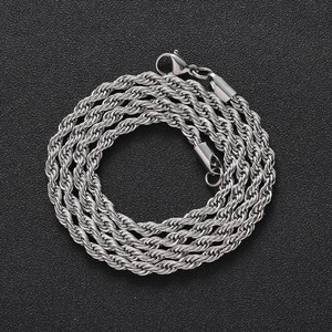 Macro shot of silver stainless steel twisted rope chain with detailed metal texture