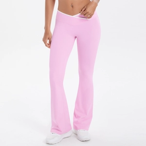 Close-up of pink flare yoga pants with crossover high waistband for fitness