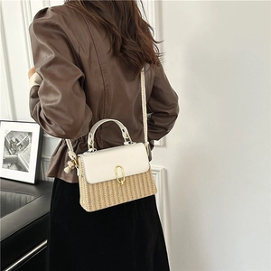 Chic beige straw crossbody bag with white leather flap and golden oval buckle