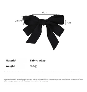 Detail view of a black satin bow hair clip with specific dimensions and material specs