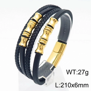Detailed macro view of black braided leather bracelet with golden stainless steel magnetic clasp