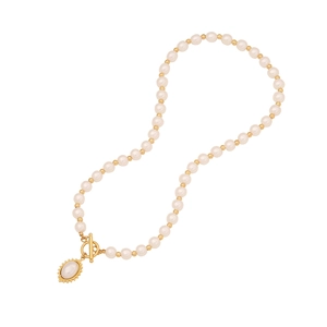 Elegant beaded heart necklace with white pearls and gold T-bar clasp on white backdrop