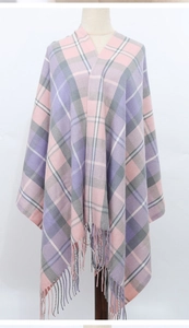 Close-up of pink and purple plaid scarf showing soft fabric texture and fringe details