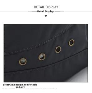 Detail of breathable metal eyelets on dark grey quick-dry flat top outdoor sun hat