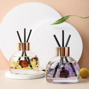 Detail of car reed diffusers with preserved flowers and black fiber aroma sticks