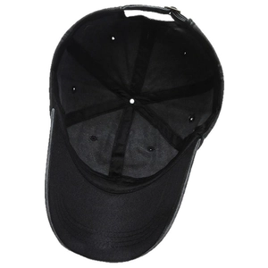 Internal view of a washed cotton baseball cap featuring reinforced seams and adjustable metal strap