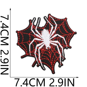 Detailed embroidery view of a 7.4cm spider web patch with black, red and white threads
