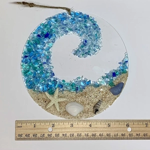 Detail view of a 6-inch ocean beach suncatcher with sea glass waves and real shells