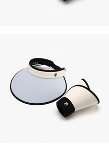 Detail showing foldable sun visor hats in light blue and beige with wide brims