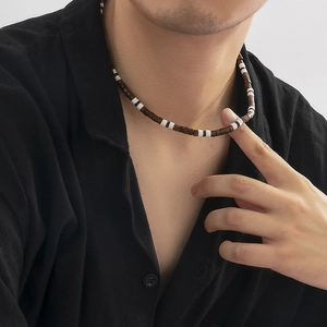 Bohemian men's necklace with dark brown wooden beads and patterned polymer clay disks