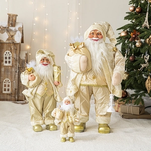 Three champagne gold and white Santa Claus figurines in various sizes for Christmas decor