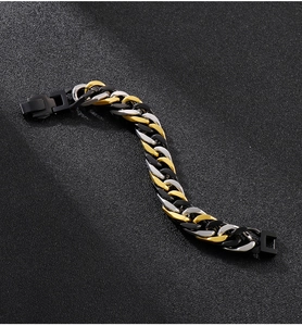 Detailed view of tri-color Cuban link bracelet in black, gold, and silver stainless steel