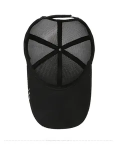 Internal view of black trucker hat showing breathable mesh panels and stitched seams