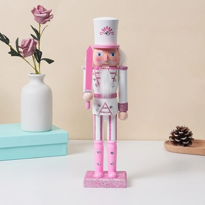 Pink wooden nutcracker soldier statue with glitter details for Christmas home decor