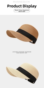 Detail von Strohhüten im Reiterstil mit elegantem schwarzem Zierband für den Sommer