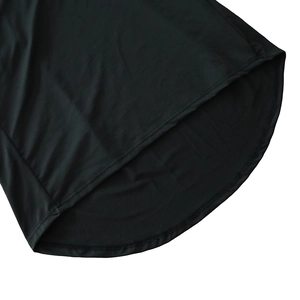Detailed close-up of the curved hemline with double-needle stitching on black dress
