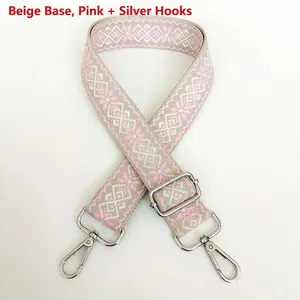 Detail of 3.8cm jacquard canvas strap with pink geometric pattern and silver metal hooks