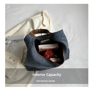 Large capacity denim tote bag showing interior storage for phone, wallet and umbrella