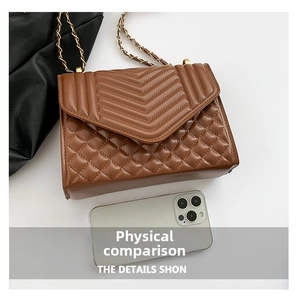 Brown quilted leather bag with diamond pattern and gold chain shown next to a phone