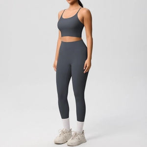 Detail view of high-waisted charcoal gray yoga set with criss-cross back sports bra