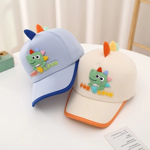 Cute kids dinosaur baseball caps in purple and beige with colorful back fins
