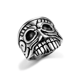 Detailed side view of vintage pirate skull ring featuring intricate scrollwork on silver steel
