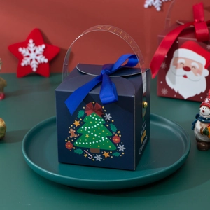 Dark blue Christmas gift box with green tree patterns and a golden 'Best Wishes' handle