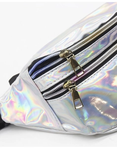 Detail shot of iridescent laser waist bag showing metallic zippers and reflective texture