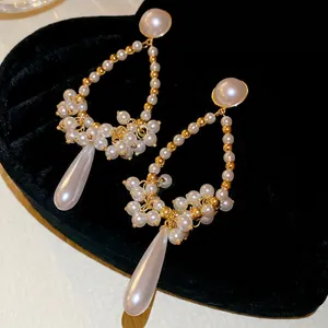French vintage style waterdrop tassel pearl earrings in gold and white pearl finish